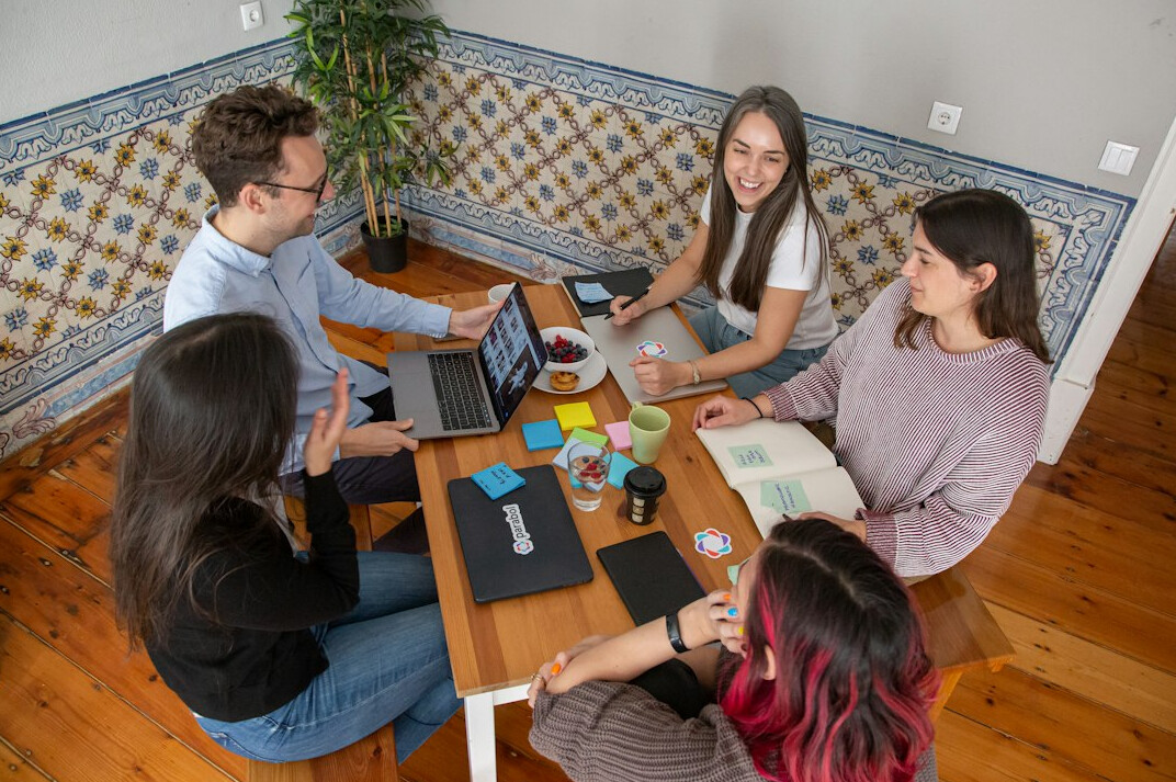 team discussing insurance software